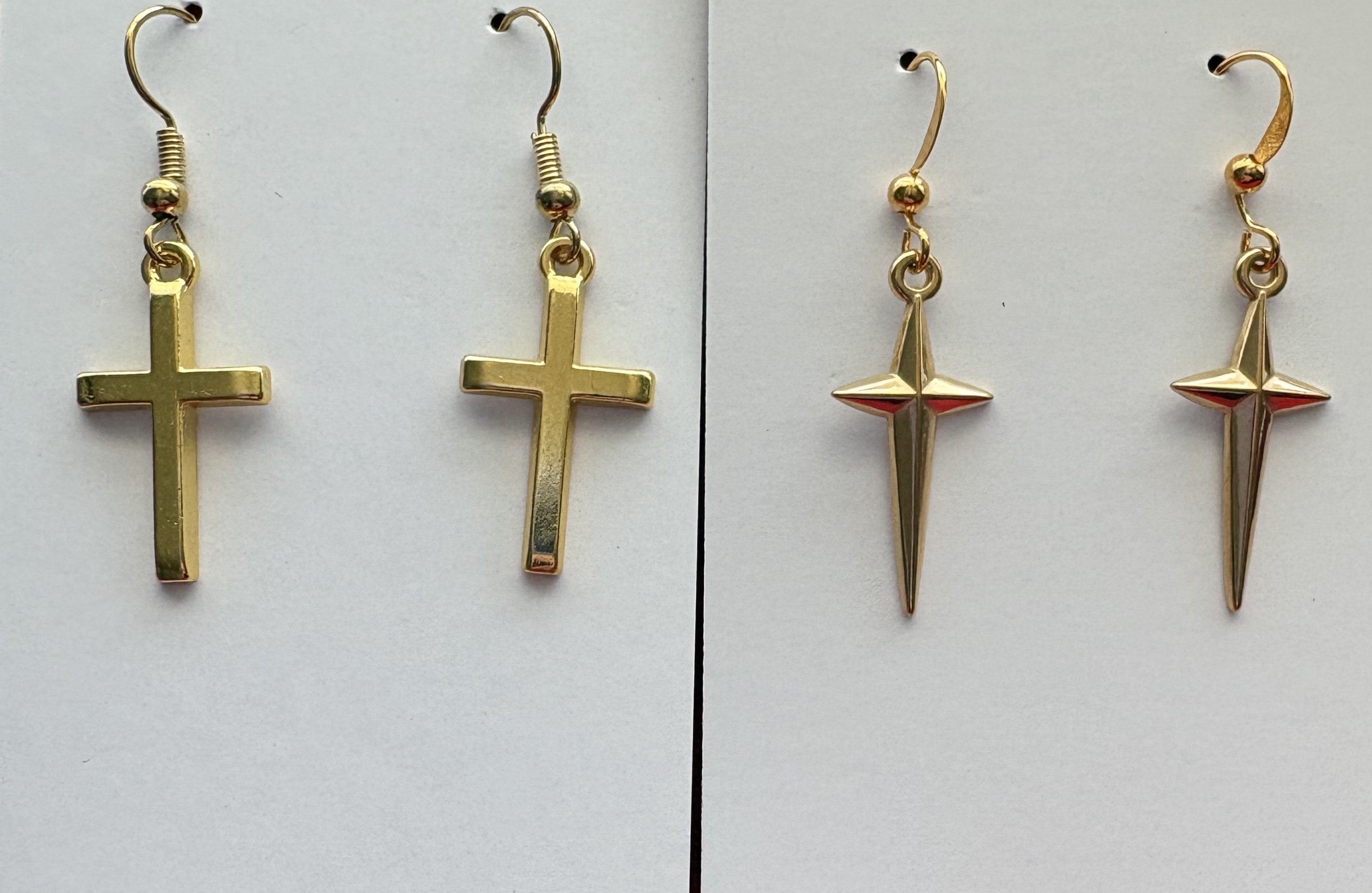 Gold cross earrings with hook closures